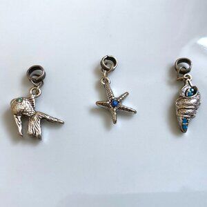 Bundle of 3 silver beach charms fish starfish conch shell.
